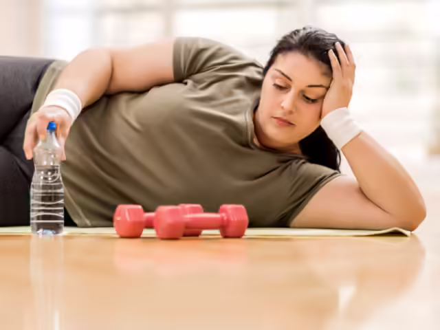 Person frustrated during weight loss plateau